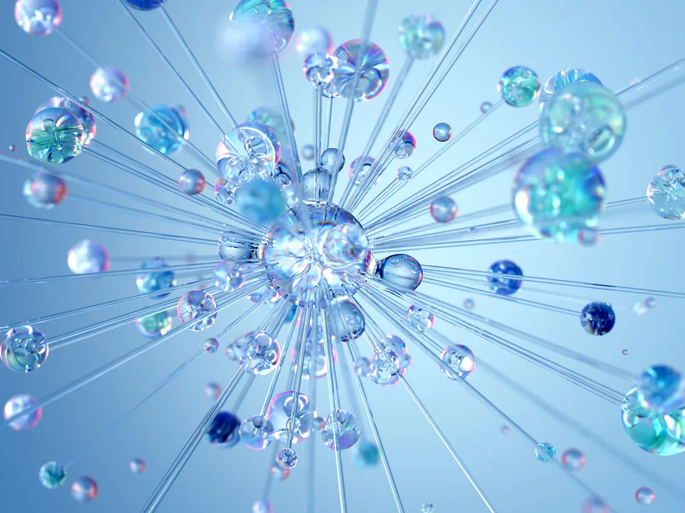 Abstrakte 3D-Darstellung einer zentralen, glasartigen Kugel mit mehreren strahlenförmig angeordneten Stäben und kleineren bunten Kugeln vor blauem Hintergrund.